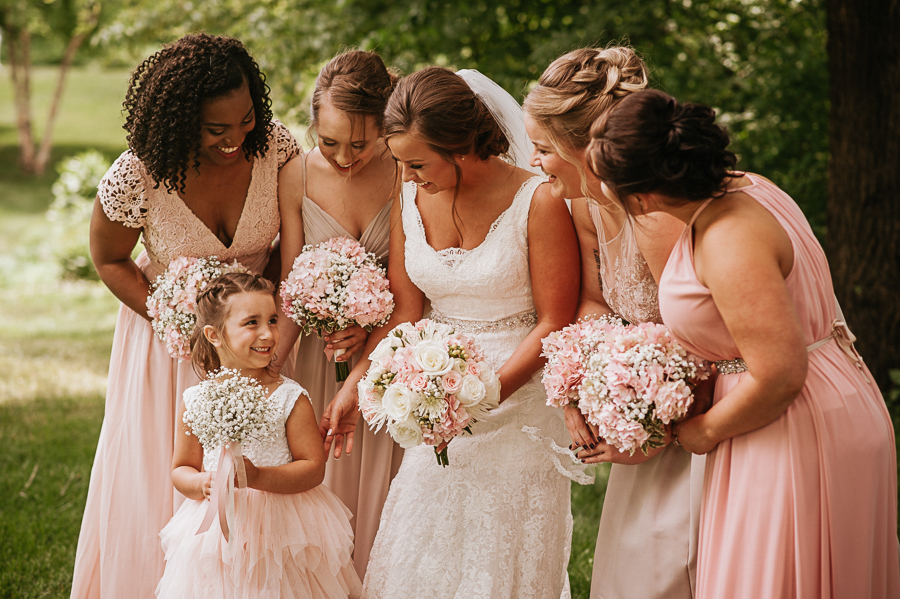 Bride and bridesmaids with flowergirl