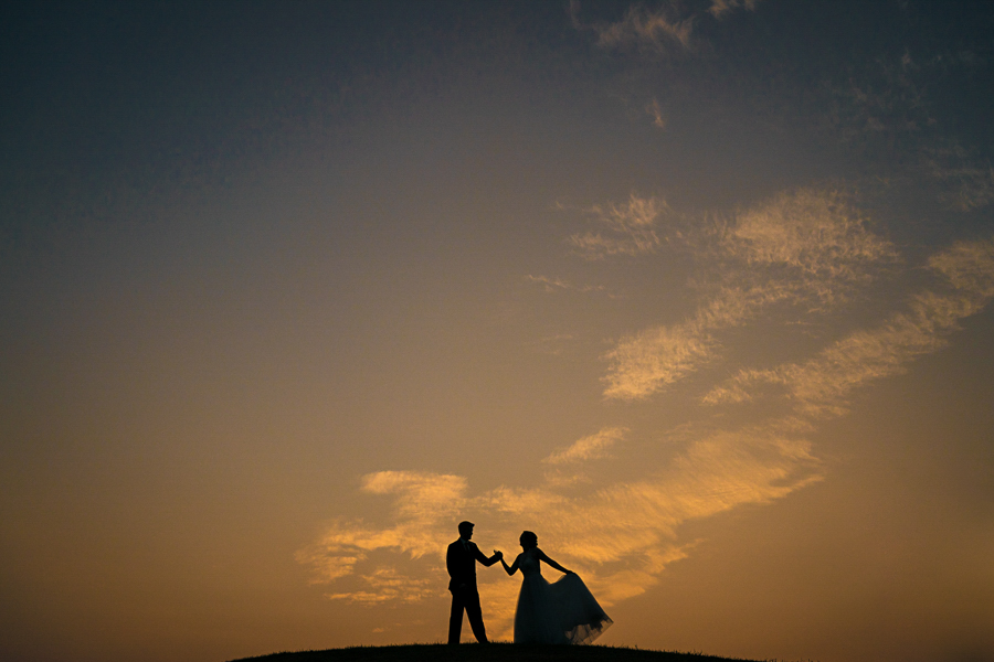 sunset silhouette bride groom