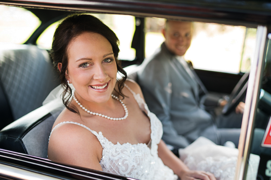 Bride and groom classic car