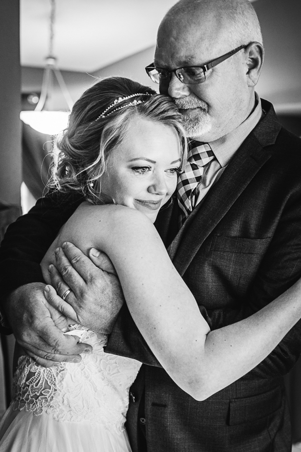 Black and white emotion with bride and dad