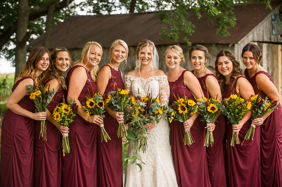 Bride and bridesmaids with sunflower bouquets