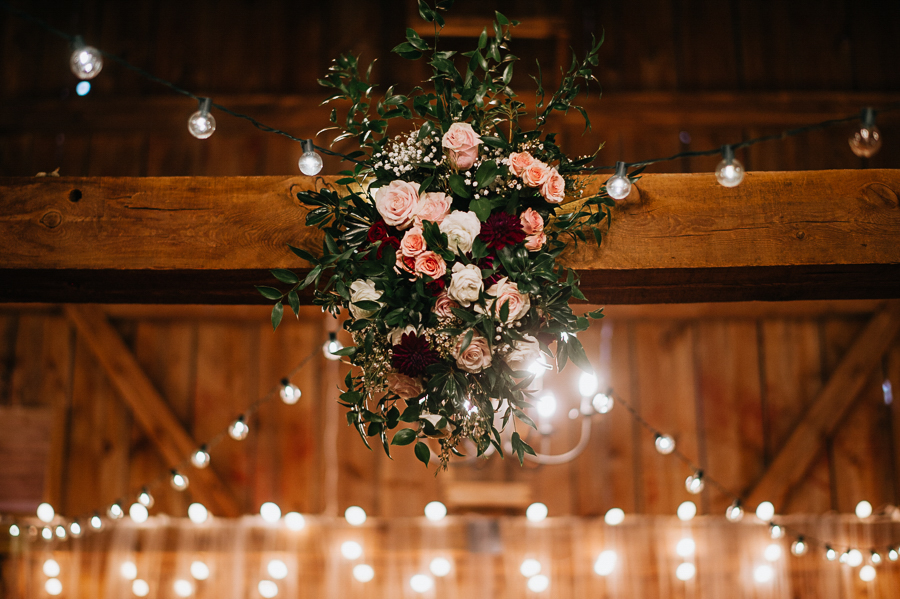 Floral details barn wedding with lights