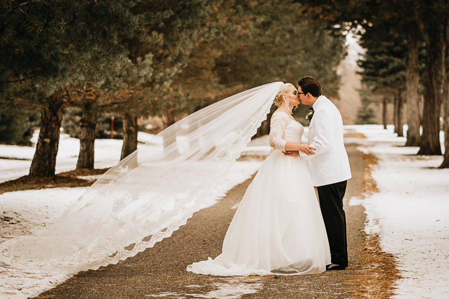 Snowy veil with bride and groom