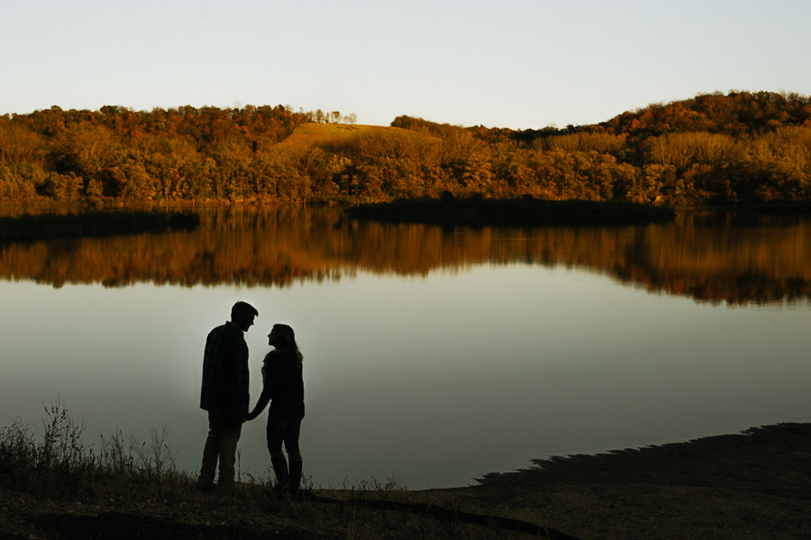 Lake silhouette with bride and groom